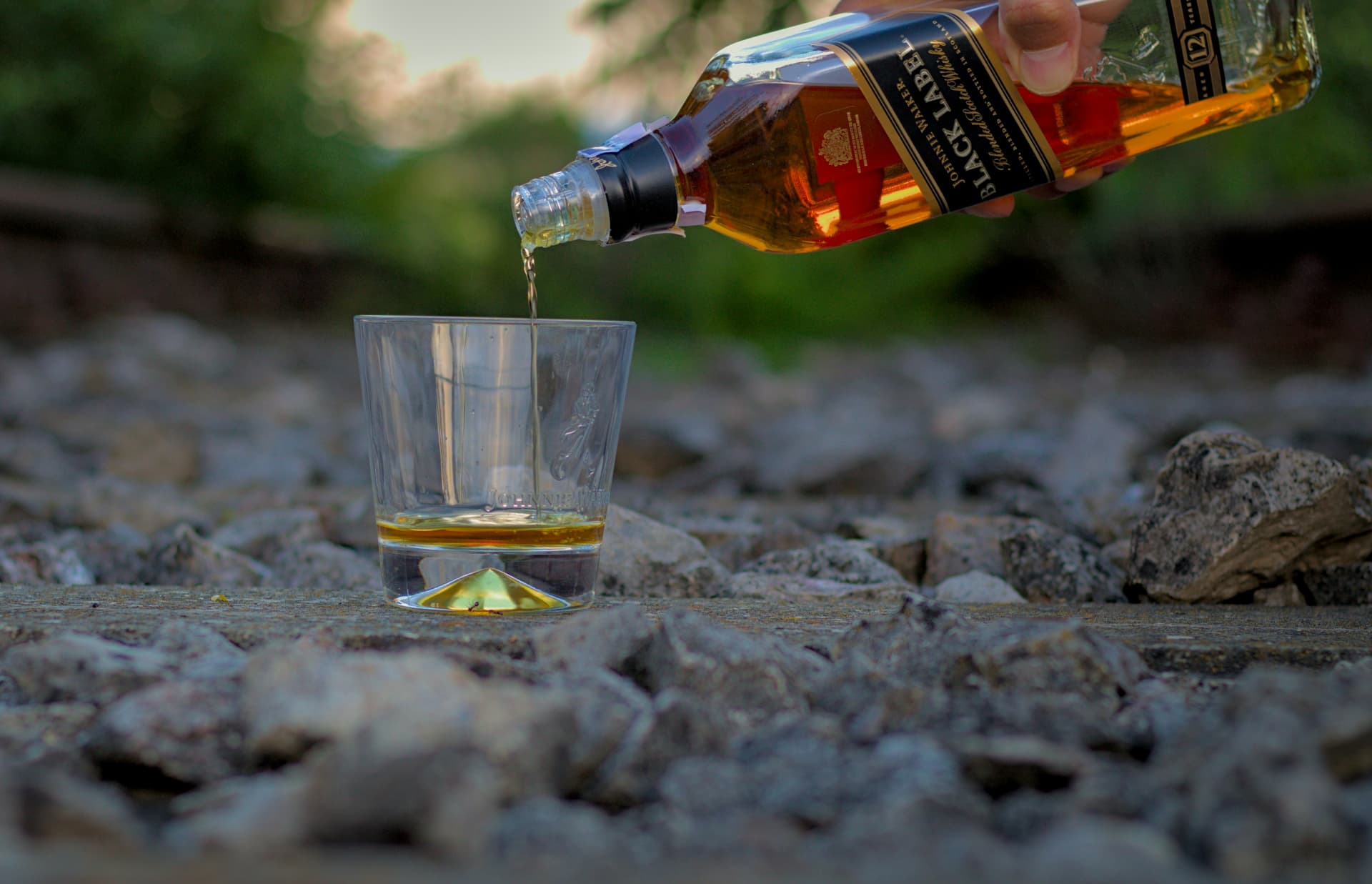 pouring whisky out of a bottle